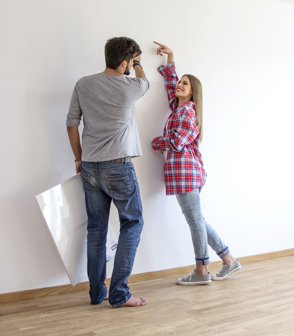 Photo of a couple in an empty room