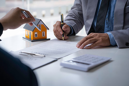 Customer talking to estate agent